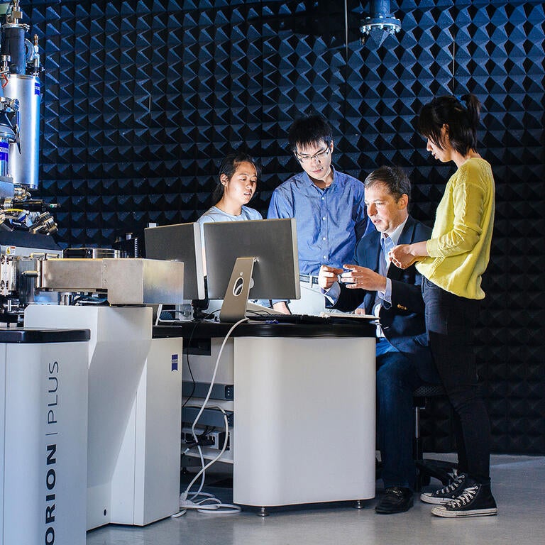 Students working with professor