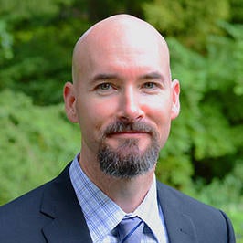 Matthew Schiller, a UCR alumnus, teaches science